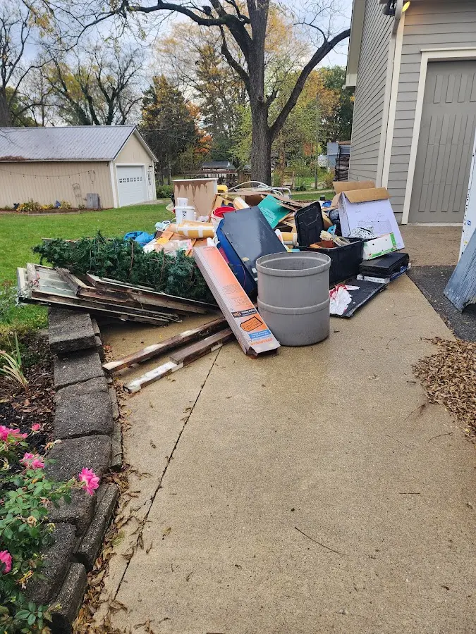 Dumpster being loaded with debris for 30 Yard Dumpster Rental in Wright